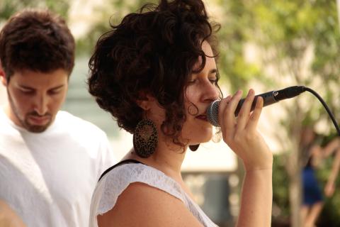 Berklee student singing in an outdoor venue