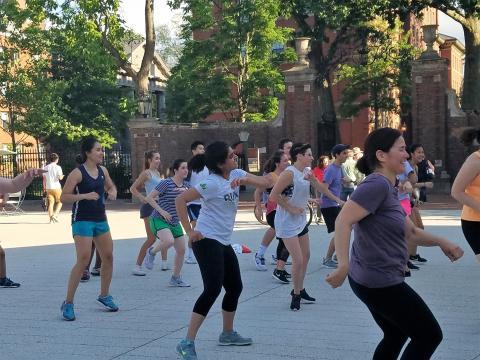 Group dancing during a Zumba class on the PLaza